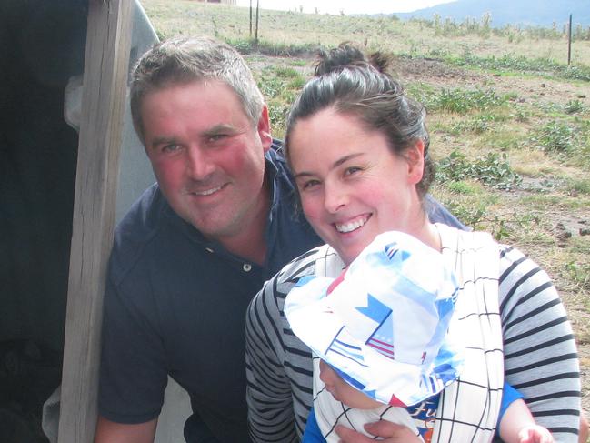 Pig producers Damien and Lillian Reardon, with baby Gideon, of Huon Valley Berkshires and boar Mr Rochester. Picture: ELAINE REEVES