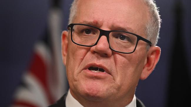 Australia's former prime minister Scott Morrison speaks to media during a press conference in Sydney on August 17, 2022. - Australia's Prime Minister Anthony Albanese on August 16 said that his predecessor Scott Morrison secretly seized control of five ministerial posts, labelling it an "unprecedented trashing of our democracy". (Photo by Steven Saphore / AFP)