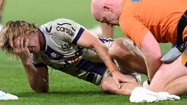 BRISBANE, AUSTRALIA - SEPTEMBER 08:  Ryan Papenhuyzen of the Storm is attended to by a team trainer after an ankle injury during the NRL Qualifying Final match between the Brisbane Broncos and Melbourne Storm at Suncorp Stadium on September 08, 2023 in Brisbane, Australia. (Photo by Bradley Kanaris/Getty Images)