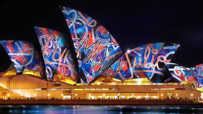 Vivid Sydney  Vivid Sydney Lighting of the Sails - Kiss of Light (2025) Photo - Vivid. Escape 18 May 2025 Hot List