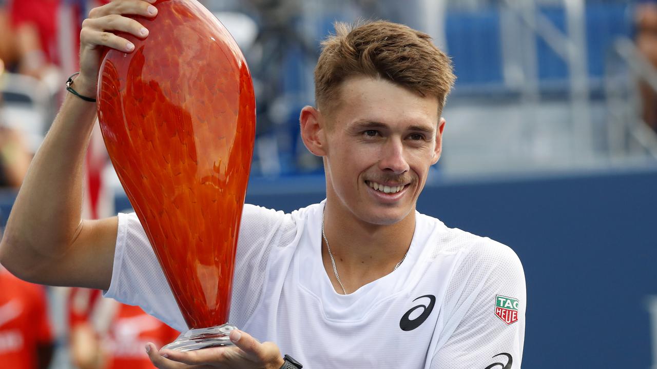 Alex de Minaur, of Australia, poses with the trophy after defeating Taylor Fritz in the finals of the Atlanta Open tennis tournament Sunday, July 28, 2019, in Atlanta. (AP Photo/John Bazemore)