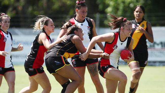 Saints' Poppy Boltz breaks free of the pack in the AFL Cairns Women's match between the North Cairns Tigers and the Cairns Saints, held at Watson's Oval, Manunda. PICTURE: BRENDAN RADKE