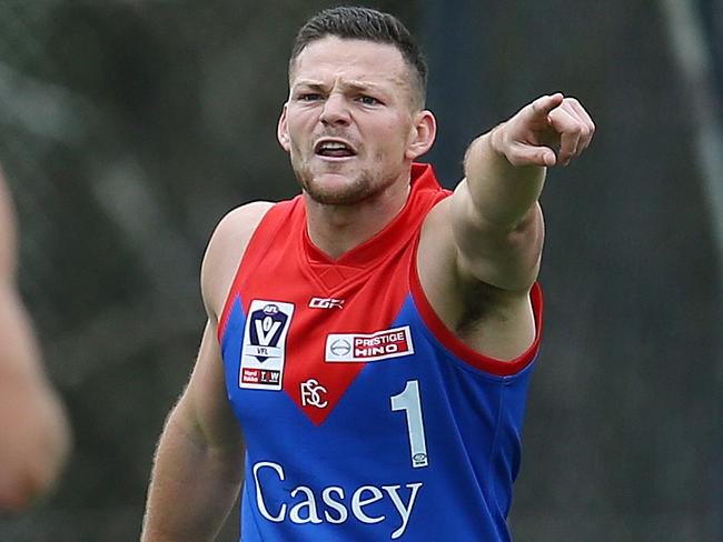 Steven May directs traffic for the Casey Demons. Picture: Michael Klein