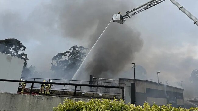 Fire crews battle the blaze at Stirling Woolworths. Picture: CFS