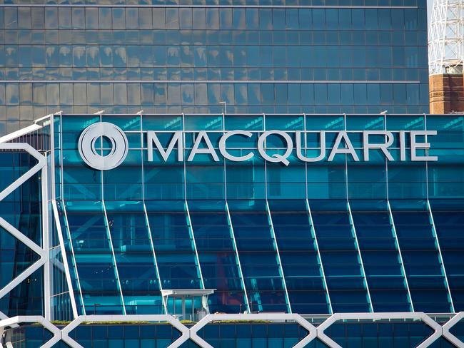 The Macquarie Group Ltd. logo is displayed on the facade of the Macquarie Group Building in Sydney, Australia, on Friday, April 27, 2012. Macquarie Group Ltd., Australia's largest investment bank, said it's relying on cost cuts to revive earnings after a slump in trading income and dealmaking dragged full-year net income to an eight-year low. Photographer: Ian Waldie/Bloomberg