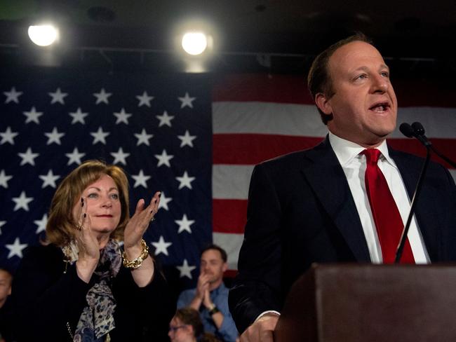 Jared Polis (right) with his running mate Dianne Primavera after their campaign victory. Picture: Jason Connolly/AFP