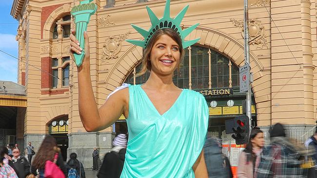 Model Anna McEvoy [from Chadwicks] dressed as the Statue of Liberty outside Flinders st Station. Picture: Alex Coppel.