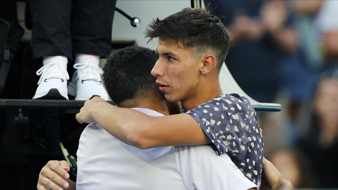 Jo-Wilfried Tsonga is consoled by Alexei Popyrin after he retired injure.