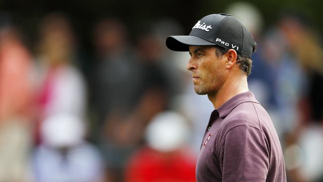 Adam Scott has again been criticised for putting with the flagstick in. Picture: AFP