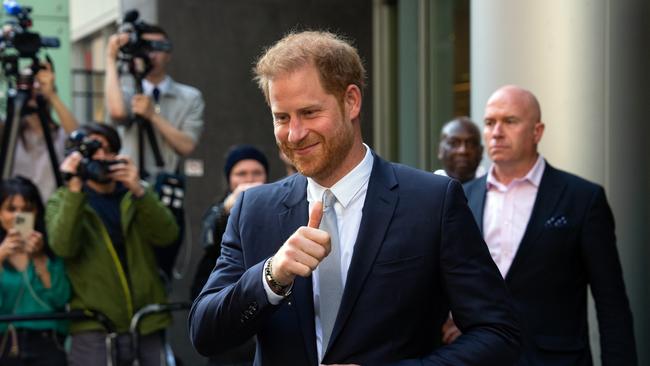 Prince Harry, Duke of Sussex, gives a thumbs up as he leaves after giving evidence at the Mirror Group phone hacking trial.