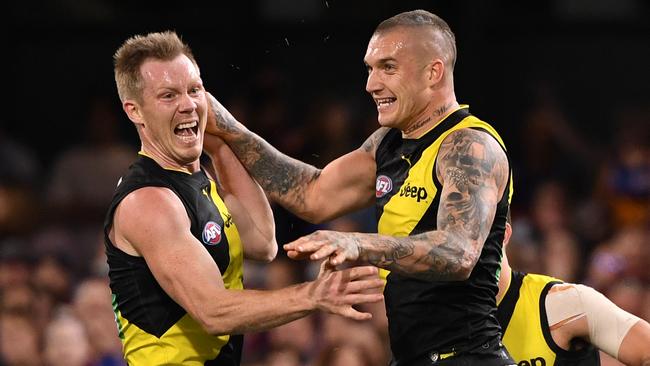 Dustin Martin celebrates one of his six goals with Jack Riewoldt. Picture: AAP