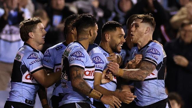 SYDNEY, AUSTRALIA - JULY 07: Jesse Ramien of the Sharks celebrates scoring a try with team mates during the round 17 NRL match between the Cronulla Sharks and the Melbourne Storm at PointsBet Stadium, on July 07, 2022, in Sydney, Australia. (Photo by Cameron Spencer/Getty Images)