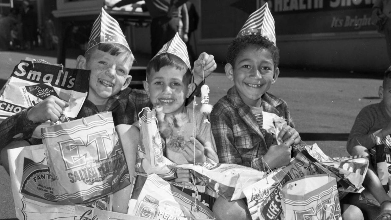 News 11/8/1956 R.N.A (EKKA ) A group of young boys had a big day out at the show with plenty of shobags being purchased. Neg no S4200.Picture by Ray Saunders. The Courier-Mail Photo Archive.Scanned April 2011.