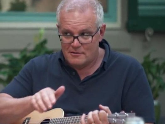 Scott Morrison playing a ukulele during a 60 Minutes interview.