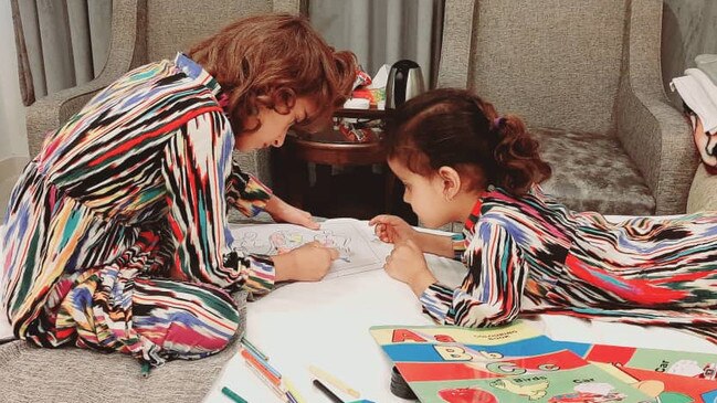 The girls had fun with colouring books, while waiting in their Pakistan hotel.