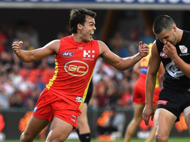 Jack Bowes of the Suns reacts after kicking the winning goal during the Round 4 AFL match between the Gold Coast Suns and the Carlton Blues at Metricon Stadium on the Gold Coast, Sunday, April 14, 2019. (AAP Image/Dave Hunt)