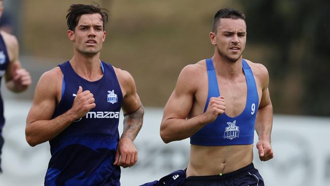 Roos co-captain Jy Simpkin (left) and Luke Davies-Uniacke have injury complaints and will have to tick ‘one more box’ to be able to face St Kilda on Sunday, Clarkson says. Picture: Michael Klein