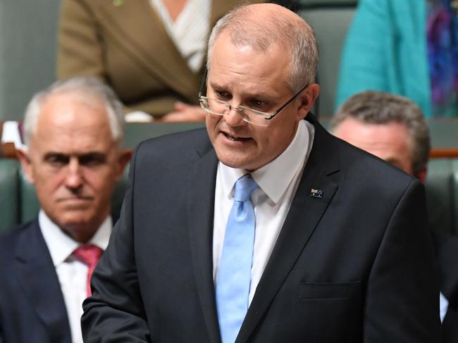 Federal Treasurer Scott Morrison hands down his third Federal Budget in the House of Representatives at Parliament House in Canberra, Tuesday, May 8, 2018. (AAP Image/Dean Lewins) NO ARCHIVING