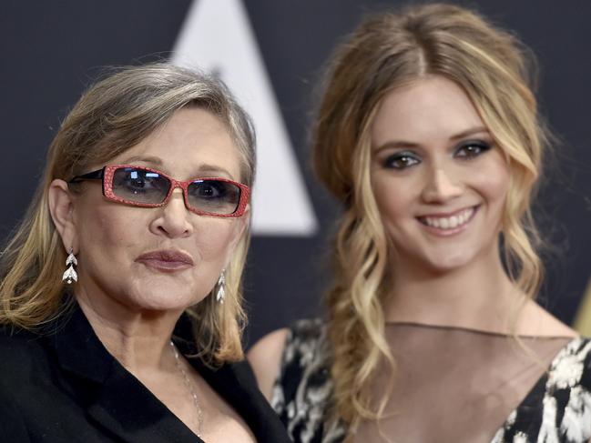 FILE- In this Nov. 14, 2015, file photo, Carrie Fisher, left, and her daughter Billie Catherine Lourd arrive at the Governors Awards at the Dolby Ballroom in Los Angeles. Fisher, a daughter of Hollywood royalty who gained pop-culture fame as Princess Leia in the original "Star Wars" and turned her struggles with addiction and mental illness into wickedly funny books, a hit film and a one-woman stage show, died Tuesday, Dec. 27, 2016. (Photo by Jordan Strauss/Invision/AP, File)