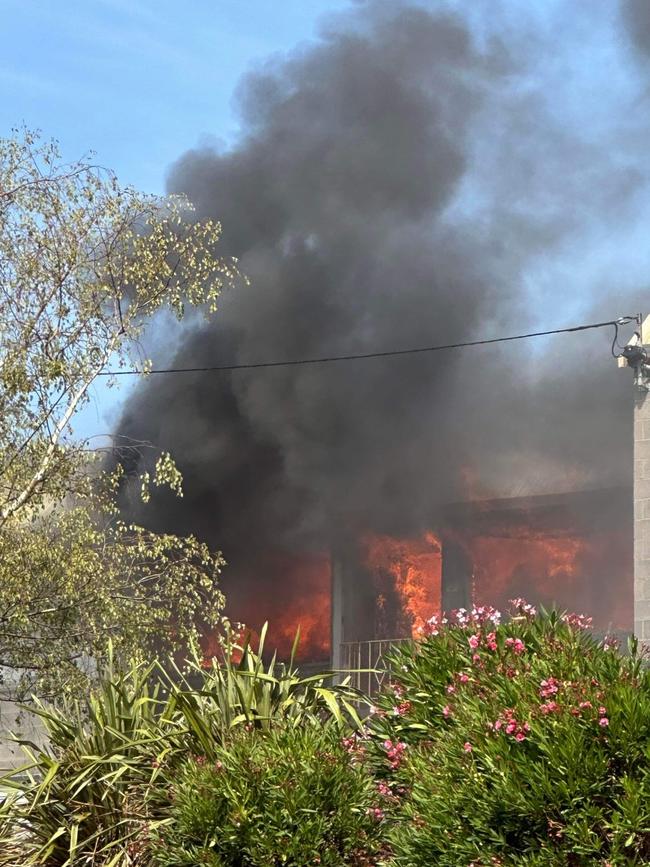 Flames engulf a Glenorchy unit at Surada Place on April 1, 2024. Picture: David Newlinds