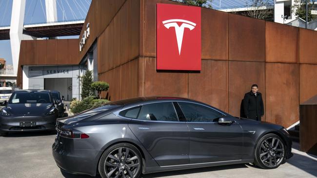 A Tesla Inc. Model S electric vehicle at the automaker's showroom in Shanghai, China. The company has dropped its price in the US to boost sales.