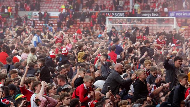 Wrexham AFC fans storm the pitch to celebrate their promotion to the Championship. Picture: Getty Images