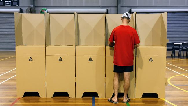 A Queenslander casts his vote at a school in Cairns. Picture: Brendan Radke