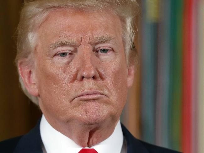 President Donald Trump waits to bestow the nation's highest military honor, the Medal of Honor to retired Army medic James McCloughan during a ceremony in the East Room of the White House in Washington, Monday, July 31, 2017. McCloughan is credited with saving the lives of members of his platoon nearly 50 years ago in the Battle of Nui Yon Hill in Vietnam. (AP Photo/Pablo Martinez Monsivais)