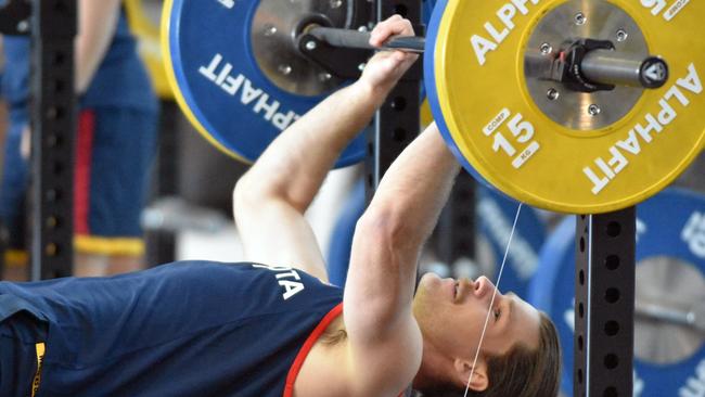 Adelaide Crows recruit Bryce Gibbs lifting weights at training.