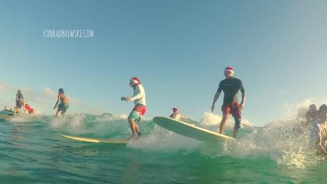 Santas hit the waves at Currumbin Alley 