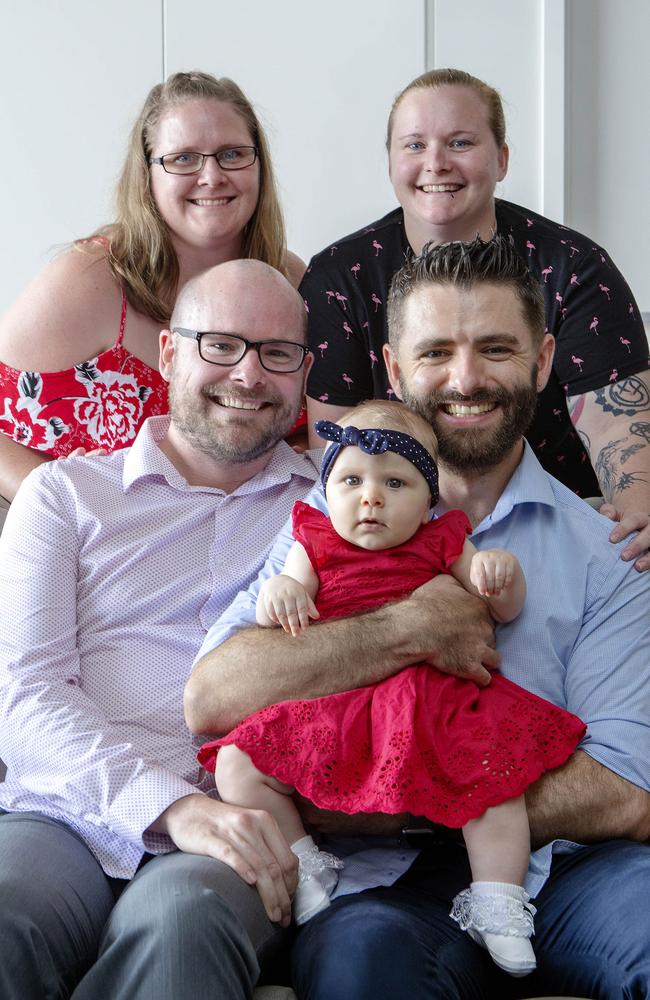 Stanley and Marco Oliveira-Gray (front left-right) are now fathers to a beautiful little Annabelle, with the help of Stan’s sisters Louise Appleton (top left) and Amanda Gray. (AAP/Image Sarah Marshall)