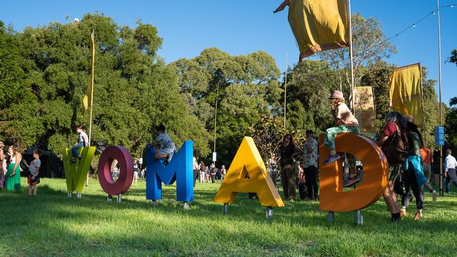 Children playing on a colourful sign at WOMADelaide festival, Botanic Park, Adelaide. Picture: Michael Selge