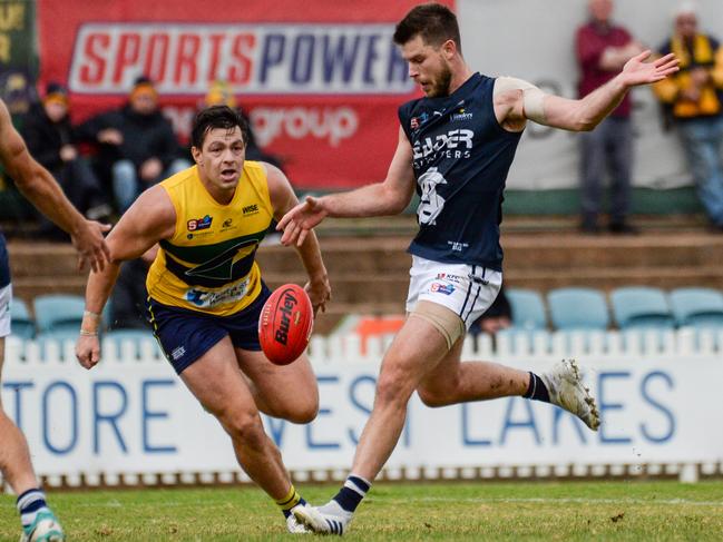 SouthÃs Bryce Gibbs kicks away from EagleÃs Jesse Lonergan during SANFL football between the Eagles and South Adelaide at Woodville Oval., Saturday May 08, 2021. Picture: Brenton Edwards