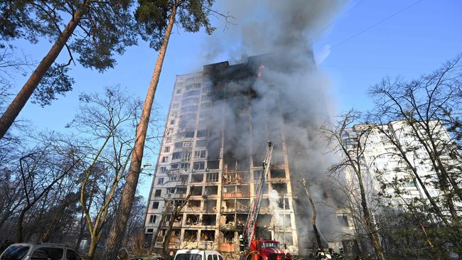 Firefighters extinguish a fire in a 16-storey residential building in Kyiv. Picture: AFP