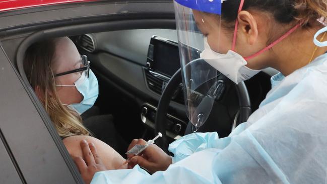 A woman gets her vaccine at the first drive-through Covid-19 vaccination in Melton. Picture: NCA NewsWire /David Crosling