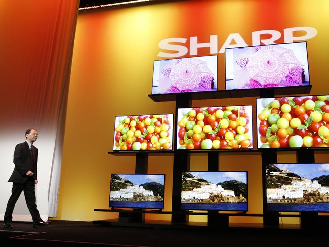 Trick of the eye ... Toshiyuki Osawa, president of Sharp Electronics Corporation, with the Sharp 4K Ultra HD. Picture: AP Photo/John Locher