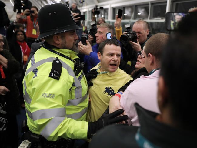 A police officer breaks up a fight while Hayes and Harlington MP John McDonnell speaks at the vote declaration. Picture: Dan Kitwood