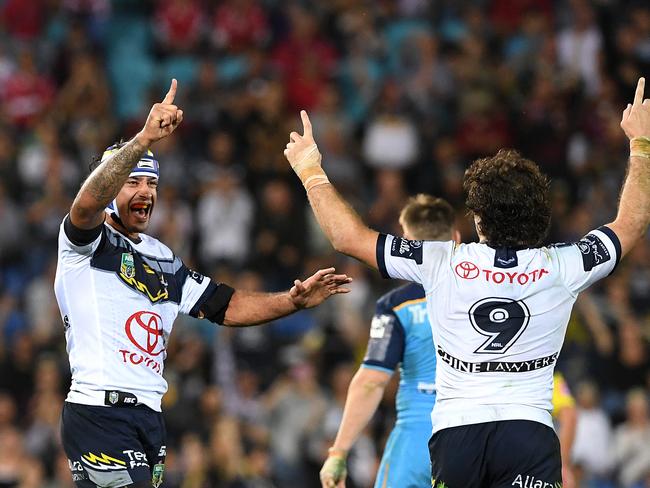 Johnathan Thurston of the Cowboys (left) celebrates a Cowboys try during the Round 25 NRL match between the Gold Coast Titans and the North Queensland Cowboys at Cbus Super Stadium on the Gold Coast, Saturday, September 1, 2018. (AAP Image/Dave Hunt) NO ARCHIVING, EDITORIAL USE ONLY