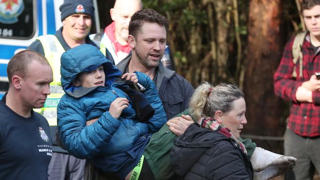 Lost boy Will Callaghan has been found alive. His mother Penny Callaghan and partner Nathan Ezard carry him. Wednesday, June 10, 2020. Picture: David Crosling