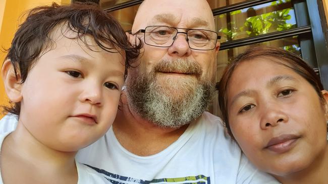 Hobart man Brett Riseley with wife Imelda and three-year-old son Tasman. They are stuck in the Philippines and unable to return to Tasmania because of coronavirus restrictions.