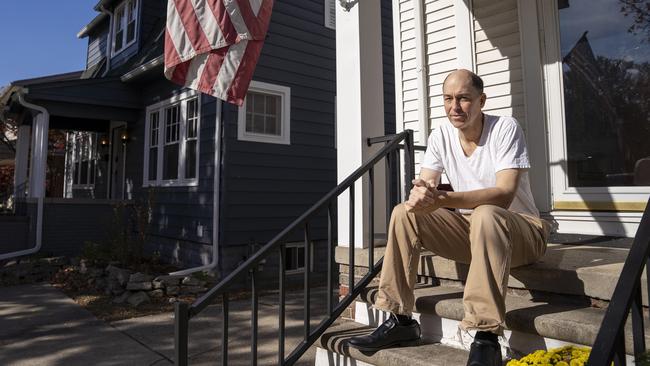 Matt Langenderfer, 55, sits on the steps outside his front door in Dearborn, Michigan. Picture: Valaurian Waller