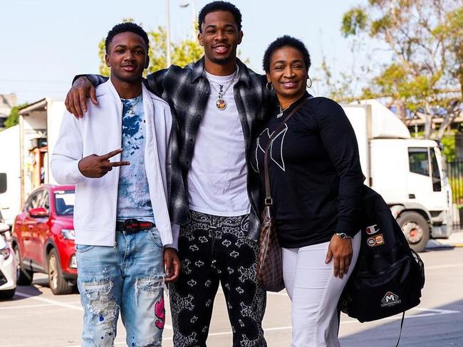 Rayjon Tucker with brother Tevin and mother Tuwanna. Picture: Melbourne United Media