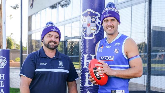 Sacred Heart Old Collegians coach Steve Kay and former South Adelaide star and current Sacred Heart Old Collegians player Alex Cailotto with special beanies, guernseys and armbands for the Breakthrough Community Round. Picture: Brenton Edwards