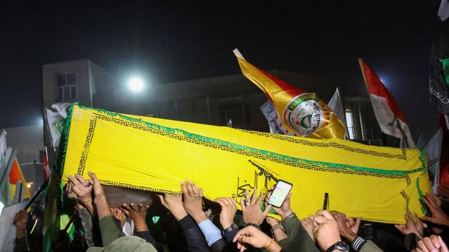 People in Baghdad carry the coffins of members of the Harakat al Nujaba group killed in a US strike that targeted a leader of the group. Picture: Reuters/WSJ