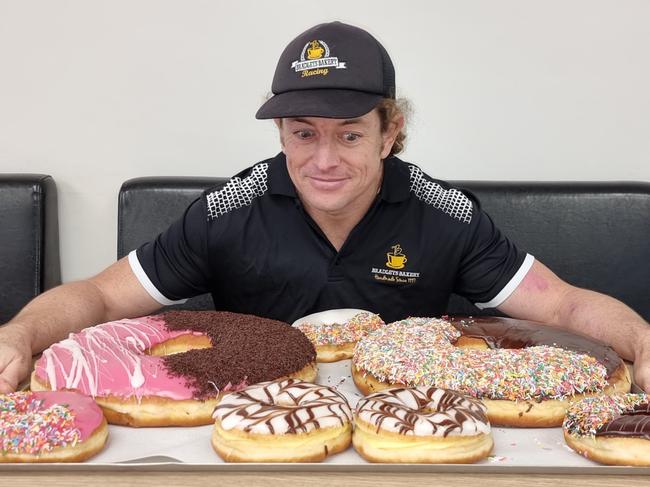 Brad Miller of Bradley’s Bakery with their huge selection of doughnuts. Picture: Supplied