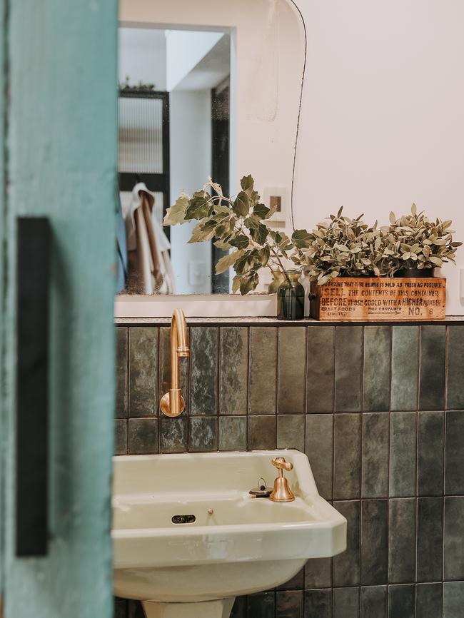 Braithwaite’s bathroom features a retro vintage pedestal hand basin and aged-brass tapware. Picture: Renee Thurston
