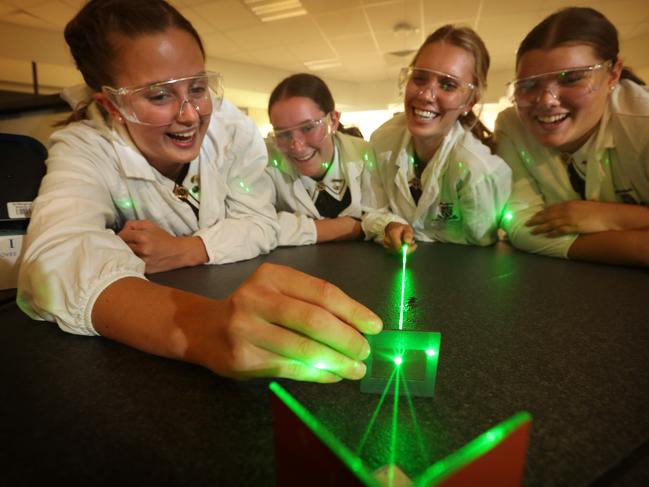 28/2/2018:L-R Penelope Crothers, Gabriella Reynolds Campbell, Lara Crouch and Hannah O'Brien, all grade 12, conduct a Young's diffraction experiment, in the Physics Lab, at St Margarets' Anglican Girls' School, Ascot, Brisbane. Girls at single-sex schools are up to 85% more likely to take advanced science, technology and maths subjects than co-ed school counterparts,  According to new research from Monash University, girls at single-sex schools were 85% more likely to take advanced mathematics than girls in co-ed schools, 79% more likely to study chemistry, 68% more likely to take intermediate mathematics and 47% more likely to study physics. Lyndon Mechielsen/The Australian