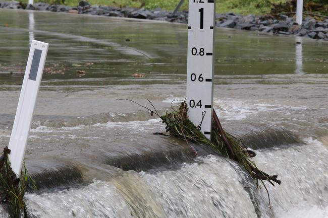 A raging Tallebudgera Creek. Picture: Glenn Hampson.