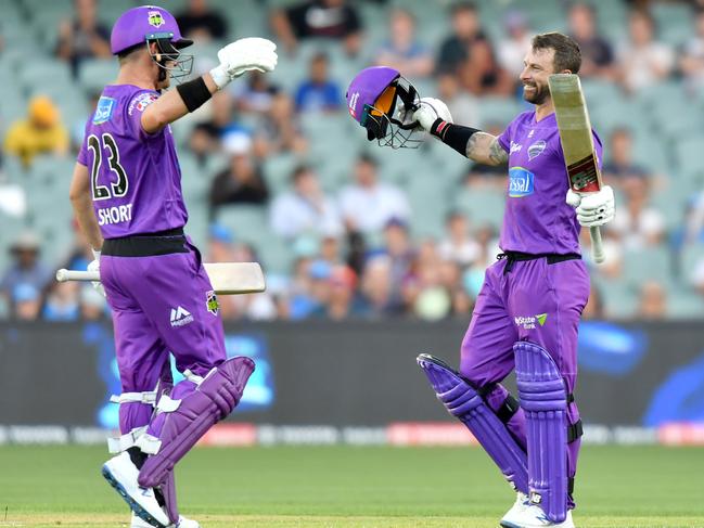 Matthew Wade (R) with D’Arcy Short after scoring his century against the Adelaide Strikers. Picture: AAP/SAM WUNDKE