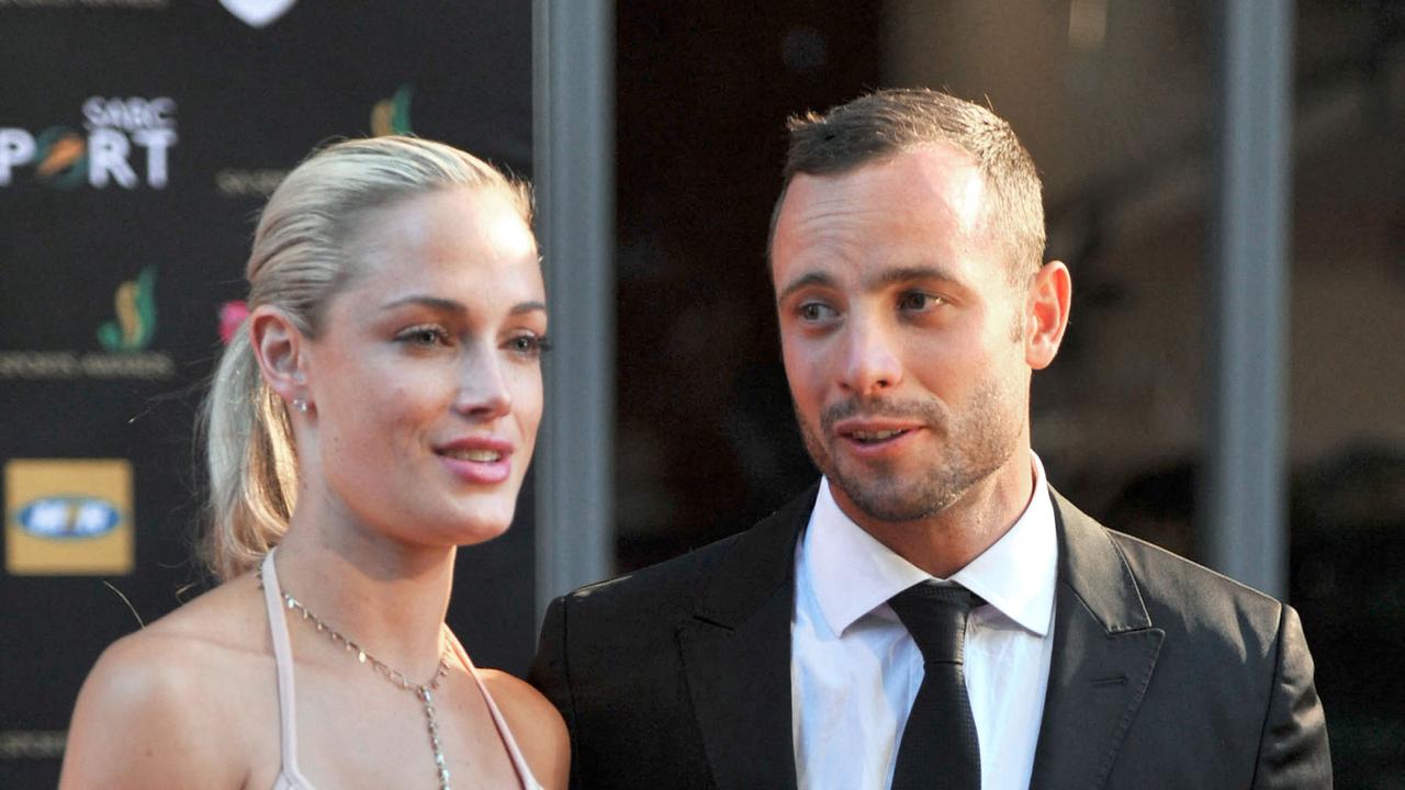 Pistorius and Reeva Steenkamp (Photo by LUCKY NXUMALO / AFP)